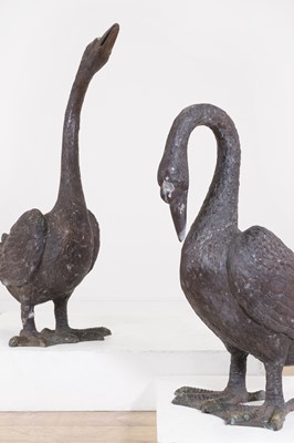 Lot 66 - A pair of patinated bronze geese