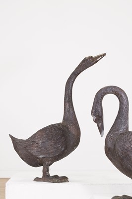 Lot 66 - A pair of patinated bronze geese
