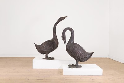 Lot 66 - A pair of patinated bronze geese