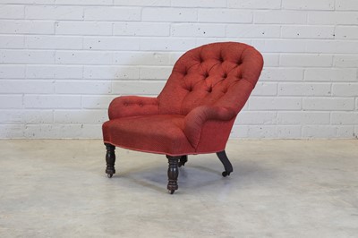 Lot 35 - An upholstered chair on turned front legs and castors