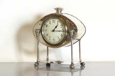Lot 85 - An Arts and Crafts silver-plated desk clock