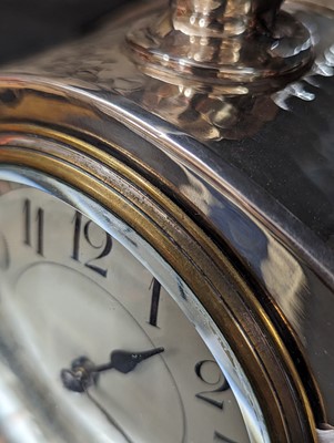 Lot 85 - An Arts and Crafts silver-plated desk clock