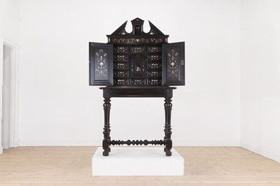 Lot 607 - An ebonised wooden and ivory-inlaid cabinet on stand
