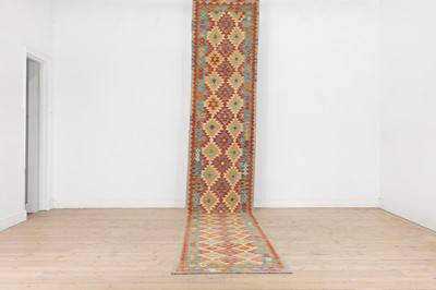Lot 551 - A kilim wool runner