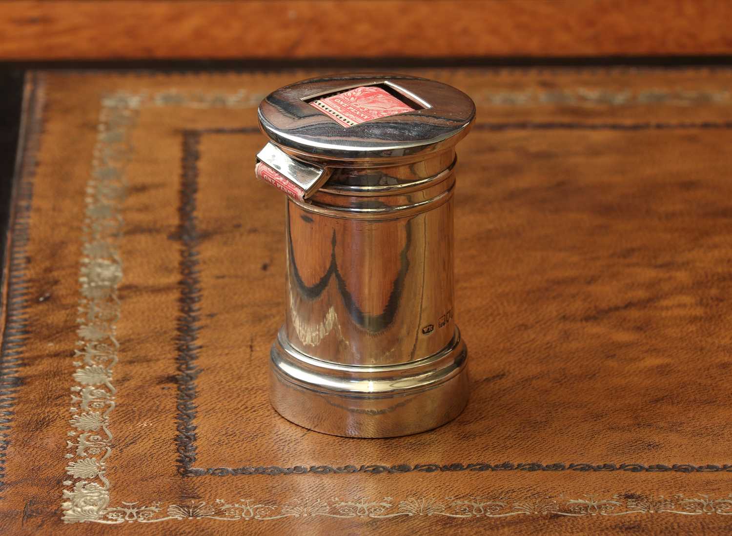 Lot 77 - A novelty silver stamp dispenser