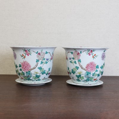 Lot 403 - A pair of Chinese famille rose jardinières with stands
