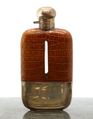 Lot 32 - A silver, leather and glass hip flask