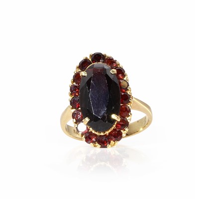 Lot 1113 - A Bohemian garnet cluster ring