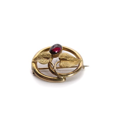 Lot 1018 - A gold garnet foliate brooch