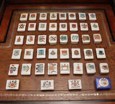 Lot 142 - A large collection of Goss Crested Ware porcelain stamp boxes