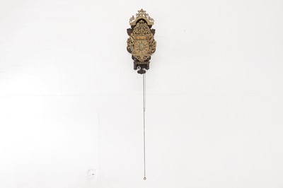 Lot 352 - A polychrome-painted 'stoelklok' wall clock