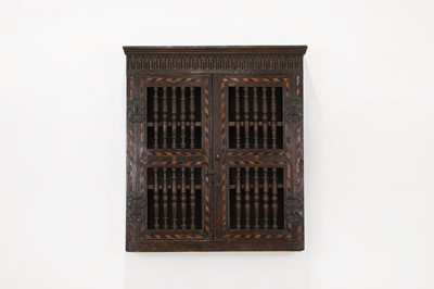 Lot 345 - A Charles I oak and inlaid ventilated livery cupboard