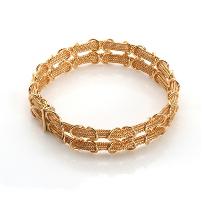 Lot 1138 - An Italian 18ct gold two row mesh link bracelet