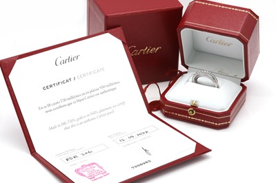 Lot 134 - An 18ct white gold 'Étincelle' three row diamond half eternity ring, by Cartier