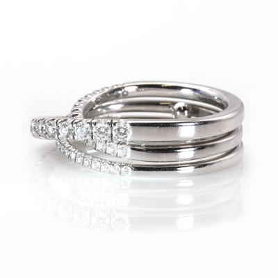 Lot 134 - An 18ct white gold 'Étincelle' three row diamond half eternity ring, by Cartier