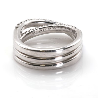 Lot 134 - An 18ct white gold 'Étincelle' three row diamond half eternity ring, by Cartier
