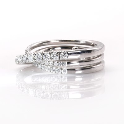 Lot 134 - An 18ct white gold 'Étincelle' three row diamond half eternity ring, by Cartier