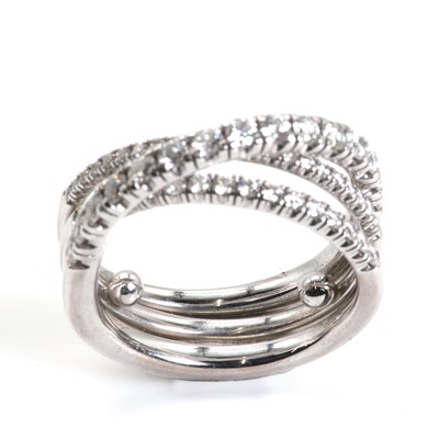 Lot 134 - An 18ct white gold 'Étincelle' three row diamond half eternity ring, by Cartier