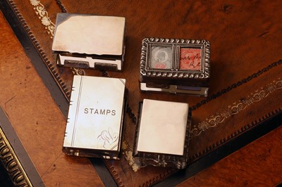 Lot 84 - A group of four silver mounted glass stamp boxes