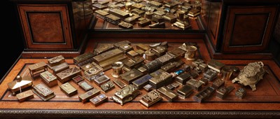 Lot 150 - A large collection of brass stamp boxes