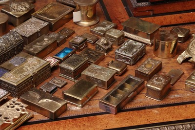 Lot 150 - A large collection of brass stamp boxes