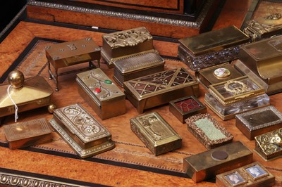 Lot 150 - A large collection of brass stamp boxes