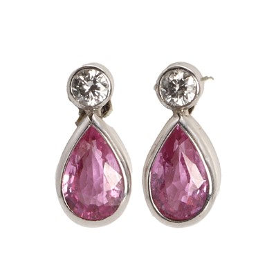 Lot 1111 - A pair of pink sapphire and diamond stud earrings