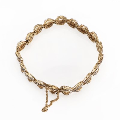 Lot 1045 - A baguette cut diamond bracelet