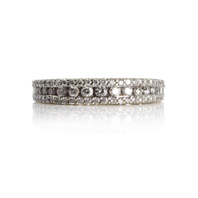 Lot 1109 - An 18ct gold and diamond bandeau half hoop eternity ring