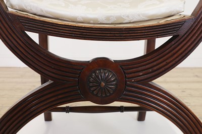 Lot 171 - A pair of mahogany armchairs in the Regency taste