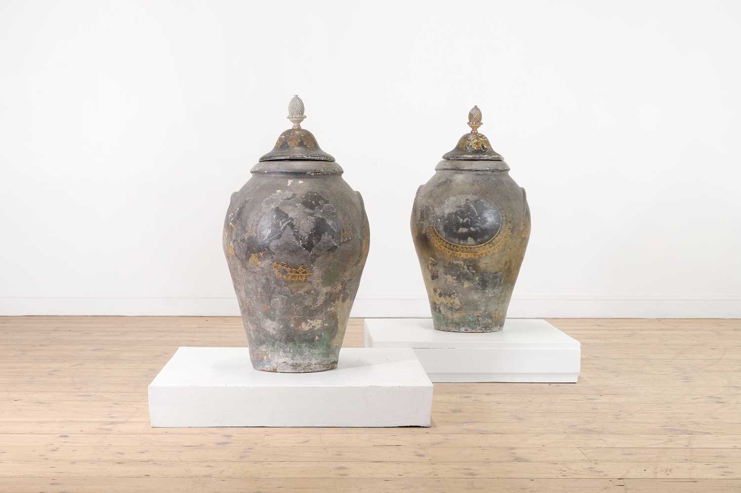 Lot 176 - A pair of painted terracotta urns