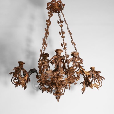 Lot 87 - A gilt-metal twelve-light chandelier