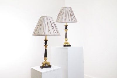 Lot 156 - A pair of Empire-style gilt and patinated bronze candlestick lamps