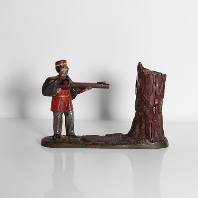 Lot 196 - An American cast iron mechanical Creedmore Bank money box