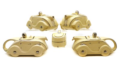 Lot 242 - A group of four Sadler art deco racing car teapots