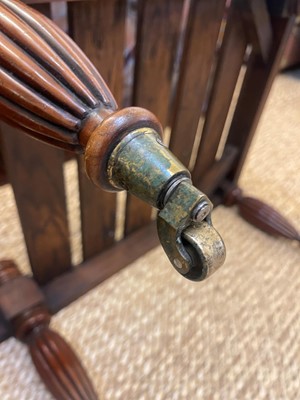Lot 6 - A Regency-style mahogany and leather stool