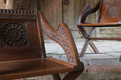 Lot 8 - A pair of carved oak Glastonbury chairs
