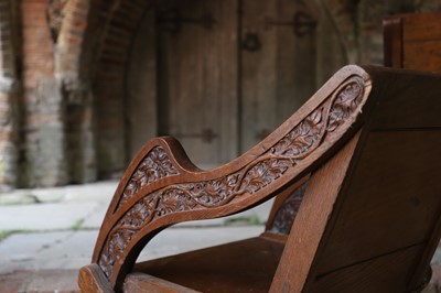 Lot 8 - A pair of carved oak Glastonbury chairs