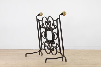 Lot 22 - A cast iron and brass fireguard
