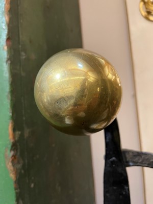 Lot 22 - A cast iron and brass fireguard