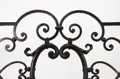 Lot 22 - A cast iron and brass fireguard