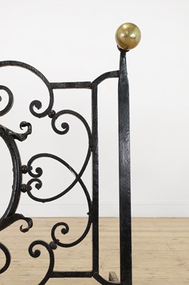 Lot 22 - A cast iron and brass fireguard