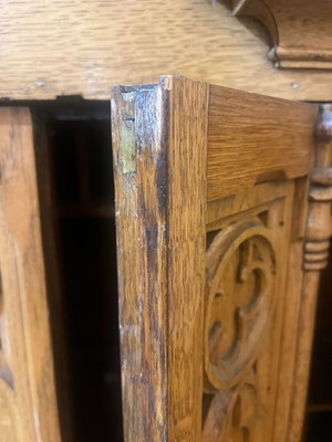 Lot 17 - A Victorian golden oak cupboard