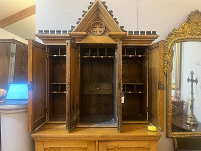 Lot 17 - A Victorian golden oak cupboard