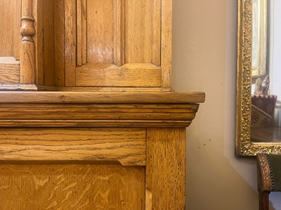 Lot 17 - A Victorian golden oak cupboard