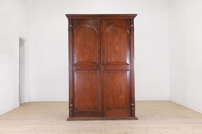 Lot 309 - A teak or padouk wardrobe