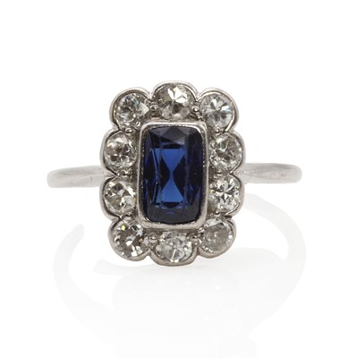 Lot 1157 - A white gold sapphire cluster ring