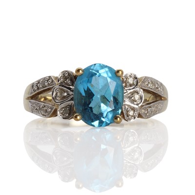 Lot 1150 - A 9ct gold blue topaz and diamond ring