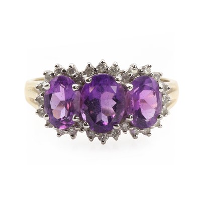 Lot 1170 - A 9ct gold amethyst triple cluster ring