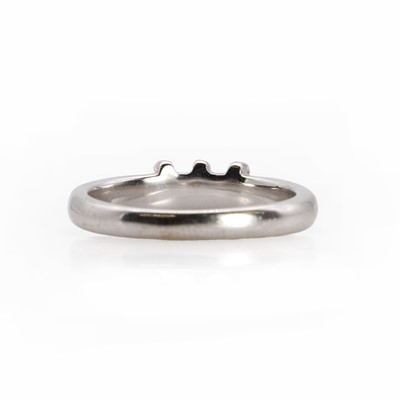 Lot 1057 - A white gold three stone diamond ring